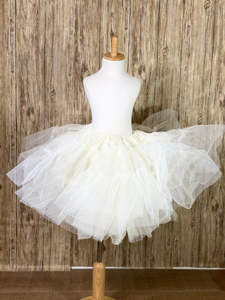 Communion and Pageant/Celebration dresses will look beautifully puffy!  The tulle petticoat is a must have to complete the look and showcase the dress!   The petticoat is ivory in color yet will go well with the white communion dresses too.  It is made with several yards of tulle layers made of net and a soft inner lining with an elastic waist band.  Small - 15 in long by 40 in wide (Girls Size 3-6)  Medium - 25 in long by 42 in wide (Girls Size 8-12)
