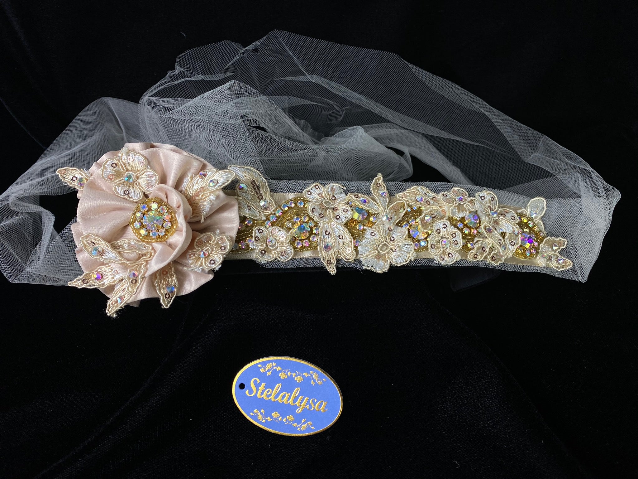 Headband with Strings - Champagne Flower and Tulle Strings  This is an elegant unique handmade and one-of-a-kind headband with a large Champagne flower and Champaign long tulle strings attached.  The large flower is uniquely decorated with rhinestones, beads, and hand stitched flowers. The soft headband is made with elegant flowers with sequins, silver sequins, and rhinestones.  