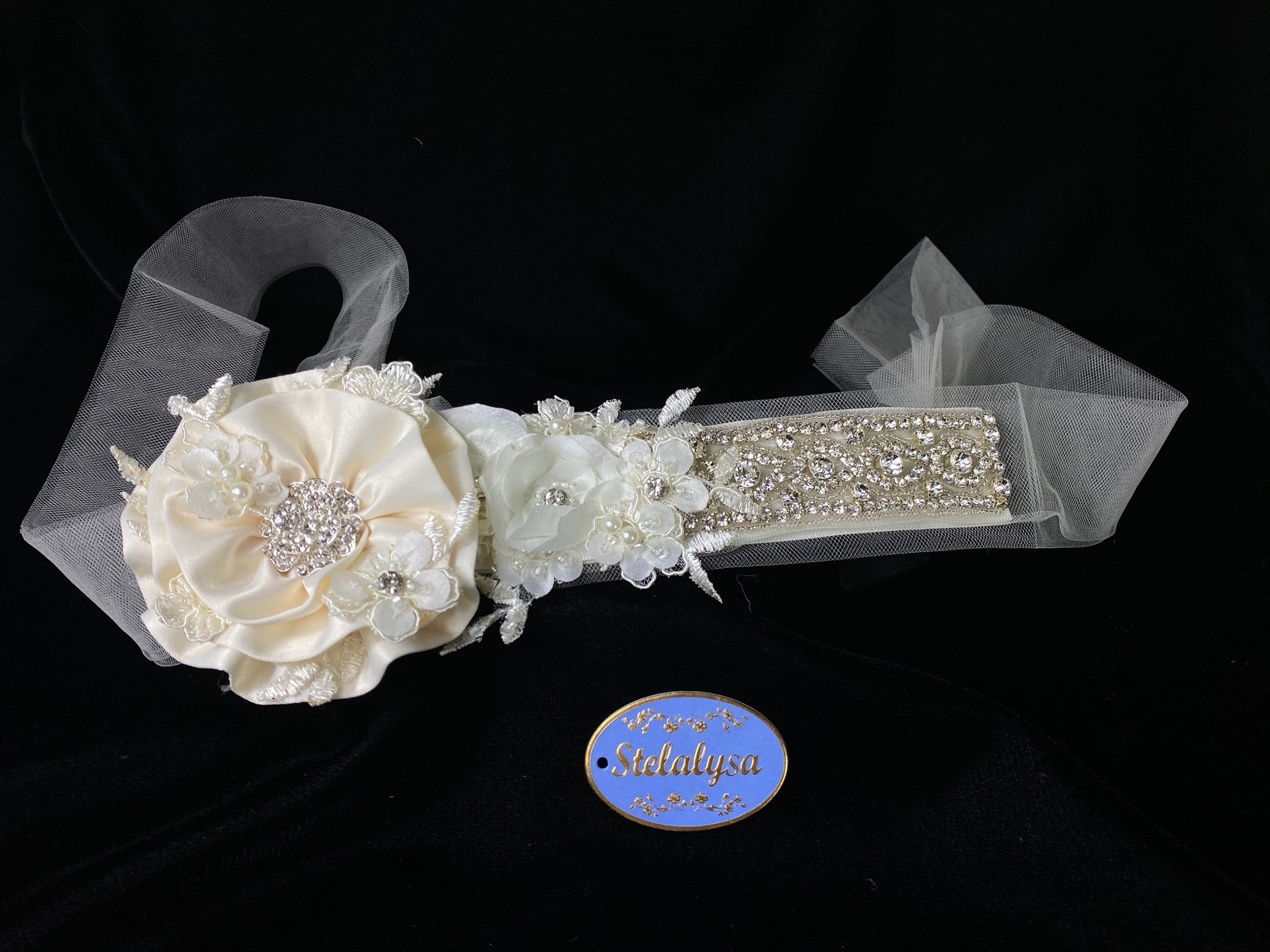Baptism / Communion Headband with Strings - Ivory Flower and Tulle Strings  This is an elegant unique handmade and one-of-a-kind headband with a large Ivory flower and long ivory tulle strings attached.  The large flower is uniquely decorated with smaller hand made flowers, rhinestones and pearls.  The headband is made of soft ivory tulle, flowers, pearls,  and rhinestones. 
