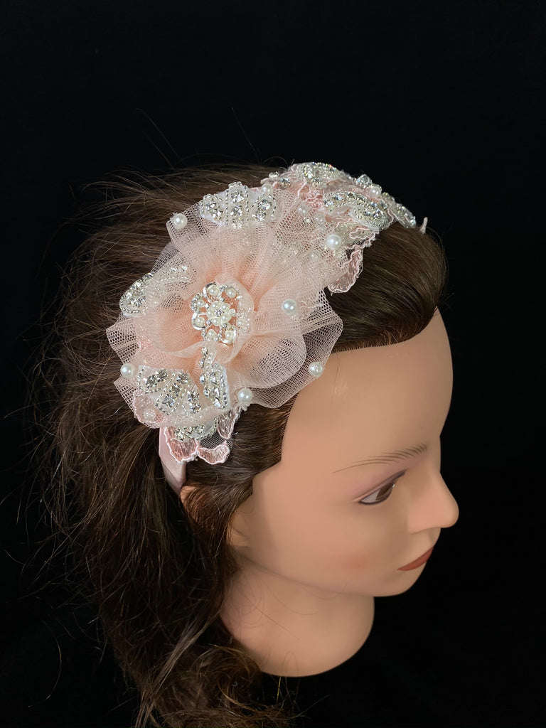 Pink Embroidered Lace Headband  This is a one of a kind, handmade light pink headband.   It is a gorgeous pink headband with embroidered lace, crystals, pearls, and beads.  Absolutely beautiful!  This headband can be use with dresses from the Celebration / Pageant Collection.    This headband fits on little girls ages 1-8.