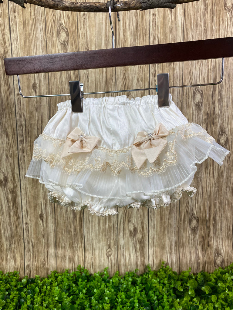 Baptism Bloomers - Ivory Bloomers with Rose Gold Bows  These ivory bloomers are exclusive to Stelalysa!  They are handmade and one of a kind.  The ruffle design in the backside is made of tulle.  Two cute pink satin rhinestones.  It's a gorgeous piece.   One size fits 3 to 12 month old babies.     These bloomers are perfect to put under any of our Baptism dresses. 
