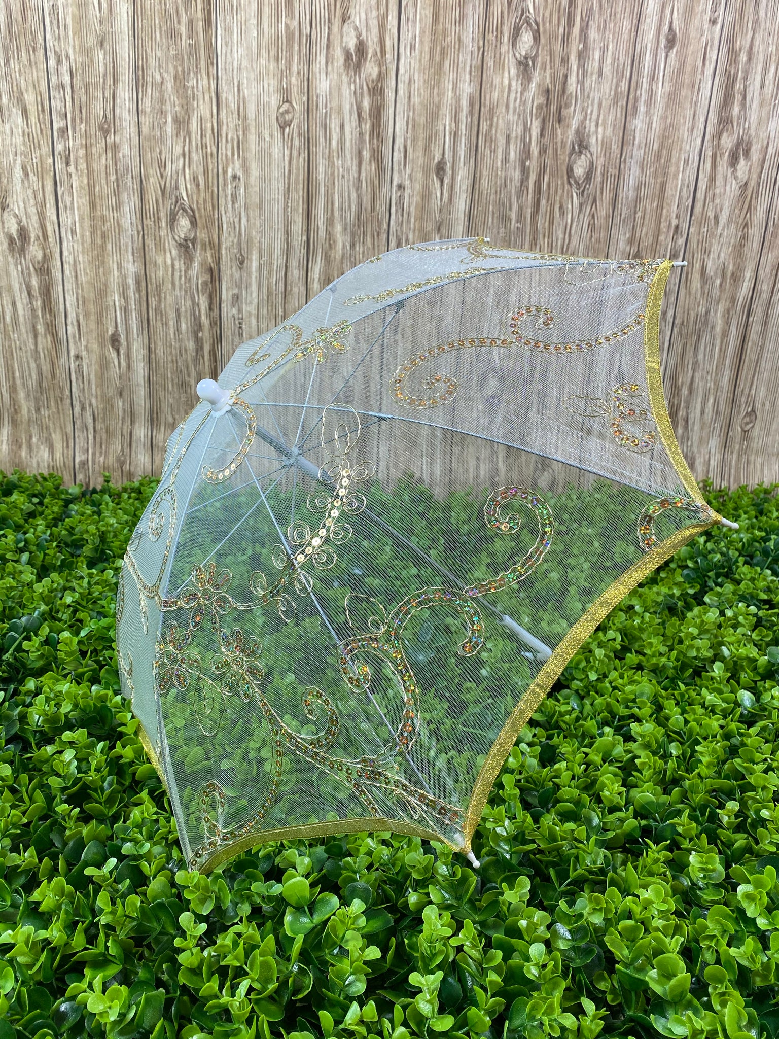 Gold see-through mesh umbrella with sequins detailing. 80in around, 30in in diameter, 20in tall Perfect for girls ages 1-6