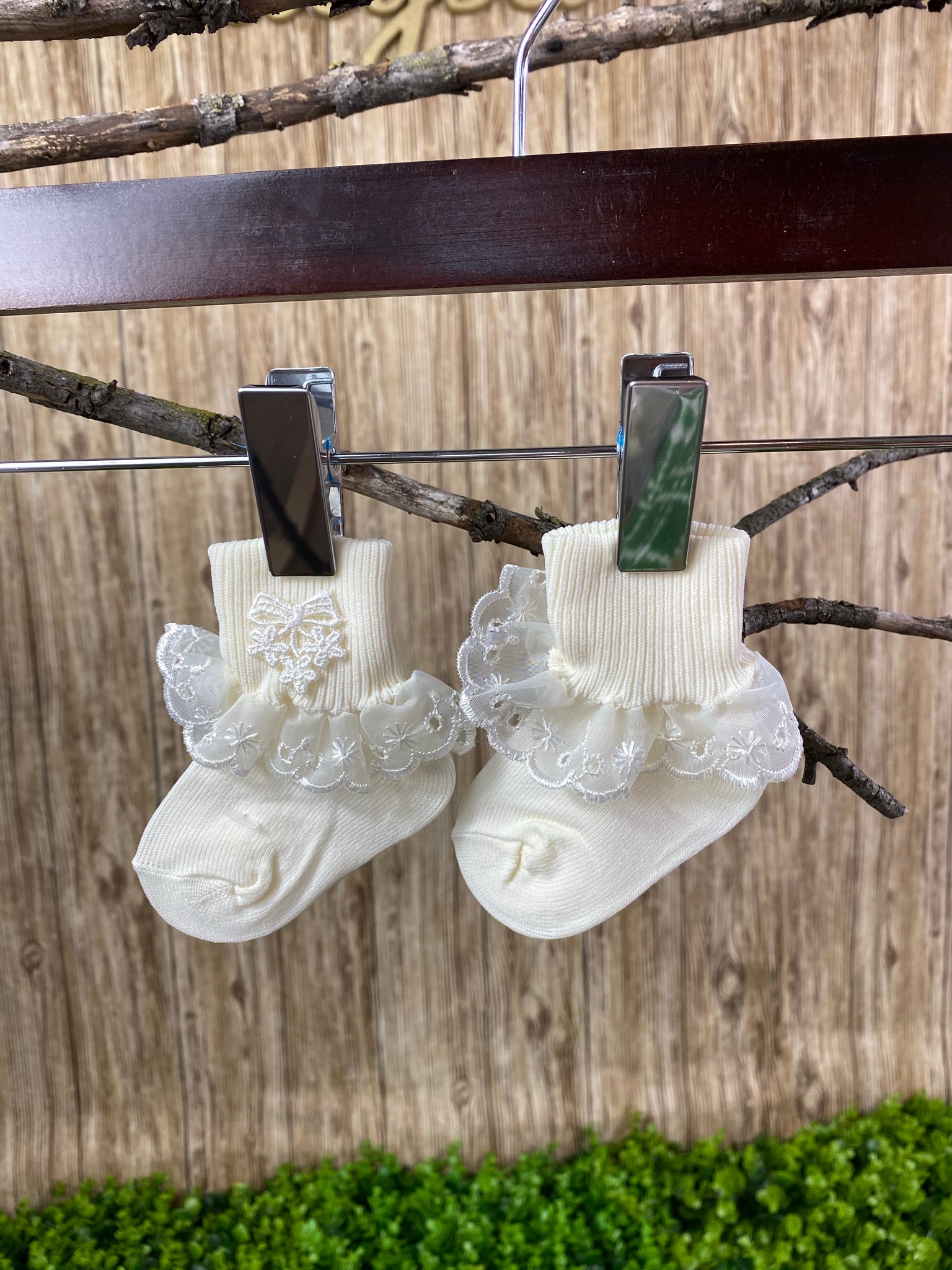 Baptism Socks - Ivory Socks with Flower  These custom ivory socks are detailed with beautiful, embroidered flowers and lace along the edge.  These are perfect for your little baby girl's outfit!  These socks are available in a newborn size.