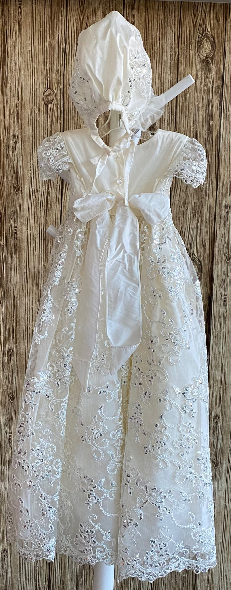 This a beautiful, one-of-a-kind baptism gown.  A lovely gown for a precious child.  Ivory, size 12M Satin bodice with embroidered sequins lace Embroidered sequins lace cap sleeve Embroidered sequins lace skirt overlay Matching bonnet