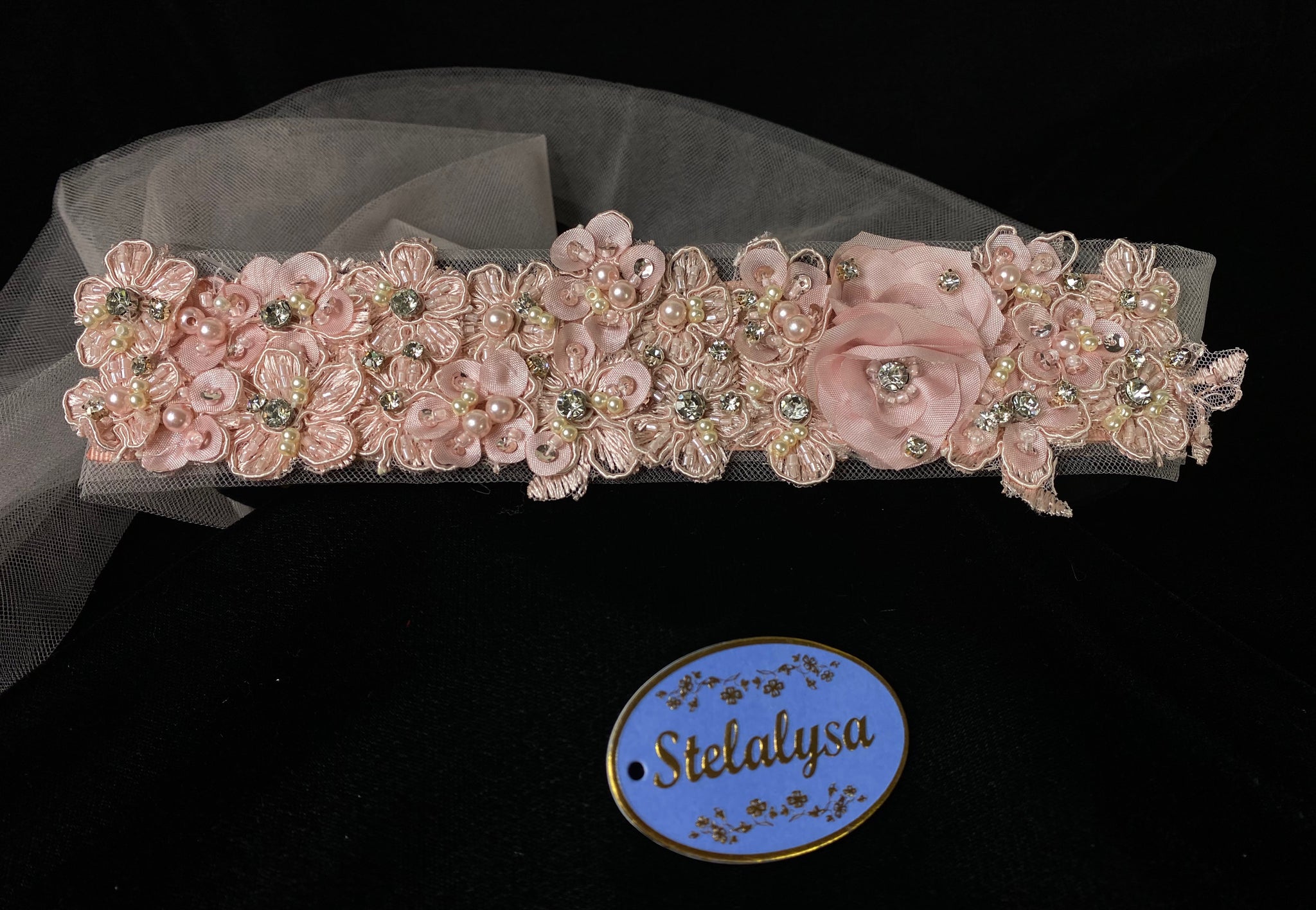 Headband with Strings - Rose Flowers and Tulle Strings  This is an elegant unique handmade and one-of-a-kind headband with a pink flowers and long tulle strings attached.  The pink flowers are uniquely decorated with rhinestones, beads, pearls, and hand stitched flowers. 