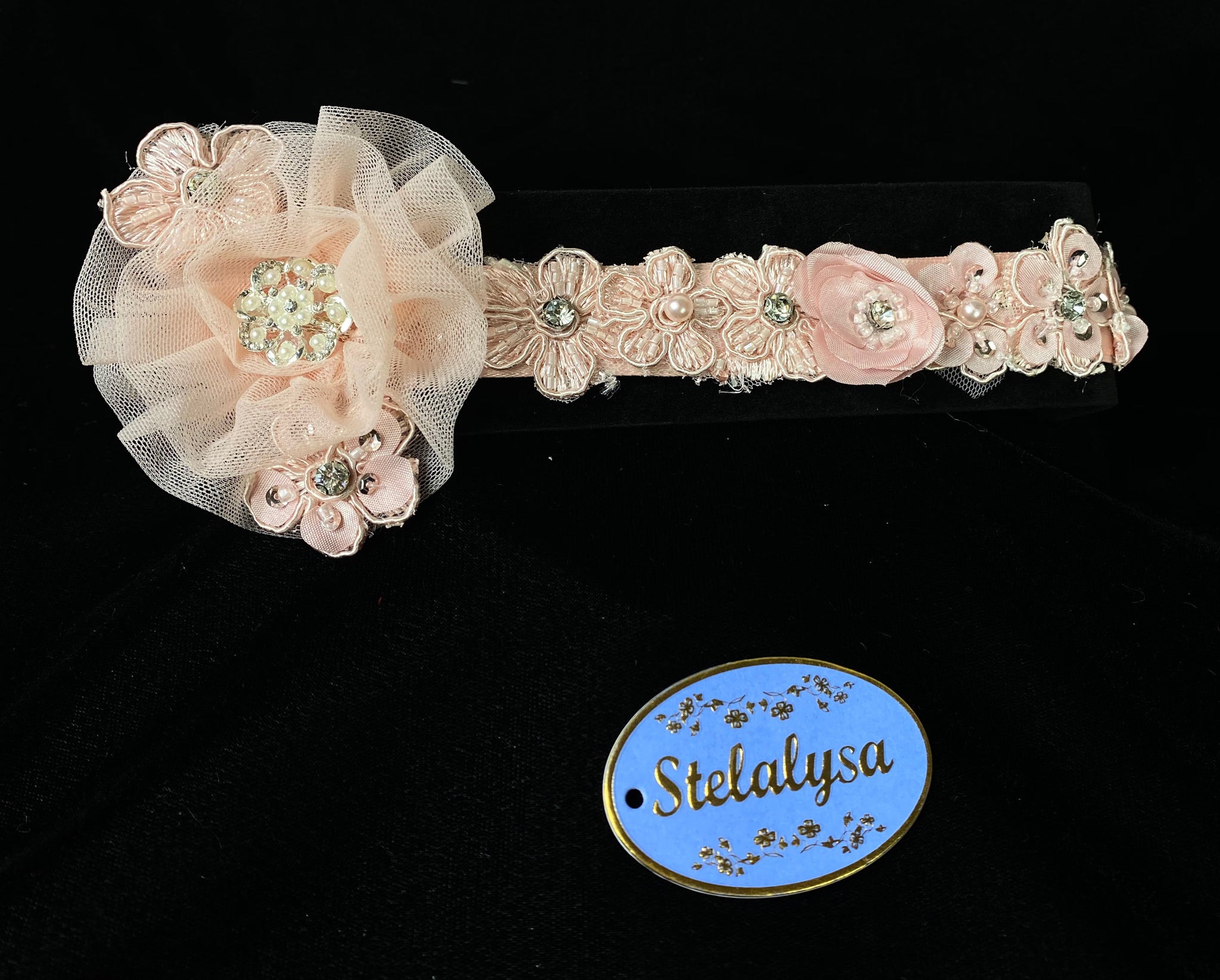 Headwrap - Pink Ribbon with Pink Tulle Flower with Pearls & Rhinestones  This is an elegant handmade and one-of-a-kind Pink headwrap with a little pink tulle flowers with pearls and rhinestones.  The headwrap is made of a soft elastic.  This headwrap can be worn with dresses from Stelalysa's Celebration/Pageant Collection and for any occasion!  It fits best on ages 1-6.