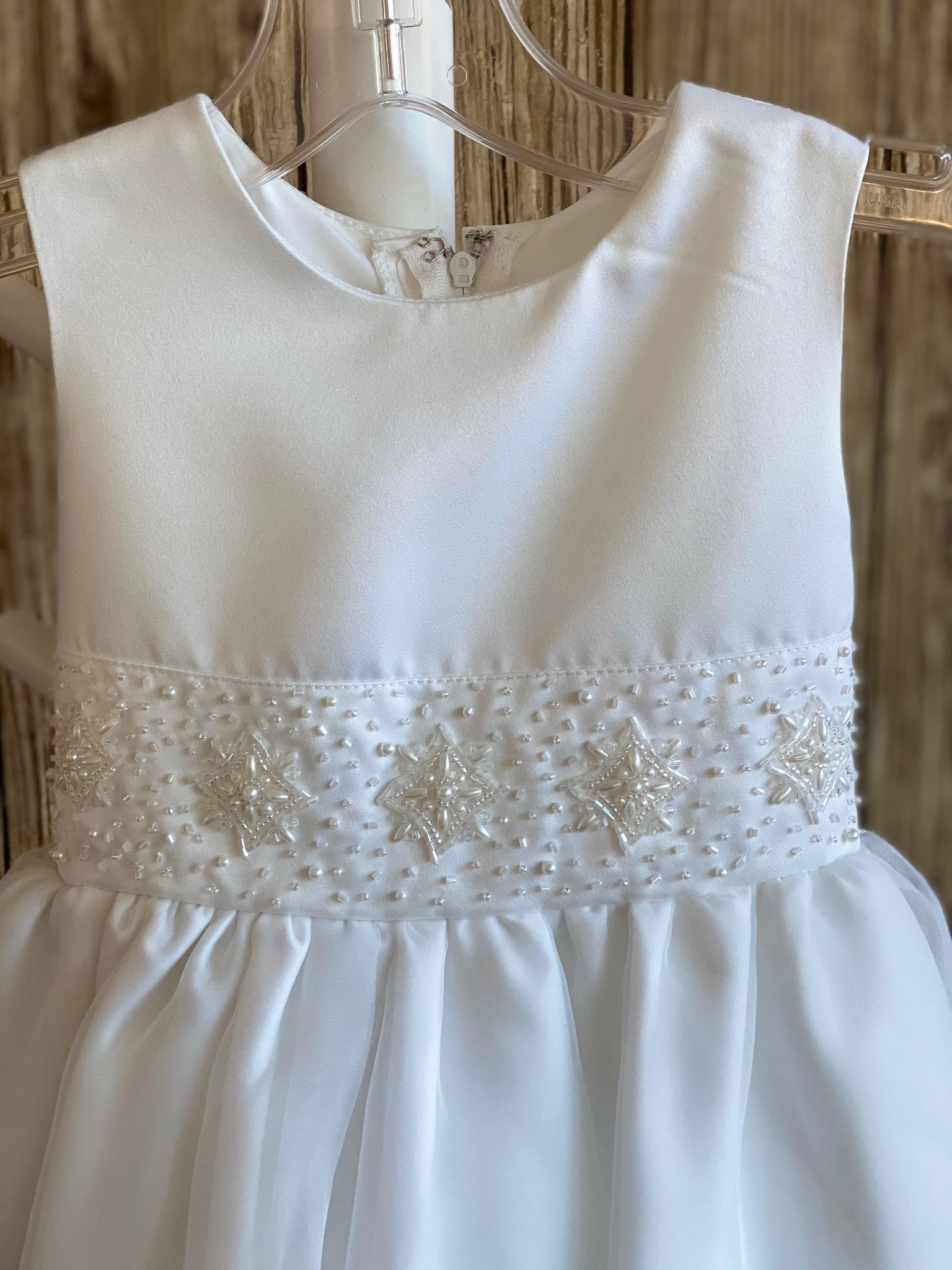 This a beautiful, one-of-a-kind baptism gown.  A lovely gown for a precious child.  White, size 24M Short sleeve Satin bodice with beaded detailing along bottom Satin skirting with mesh overlay Zipper closure