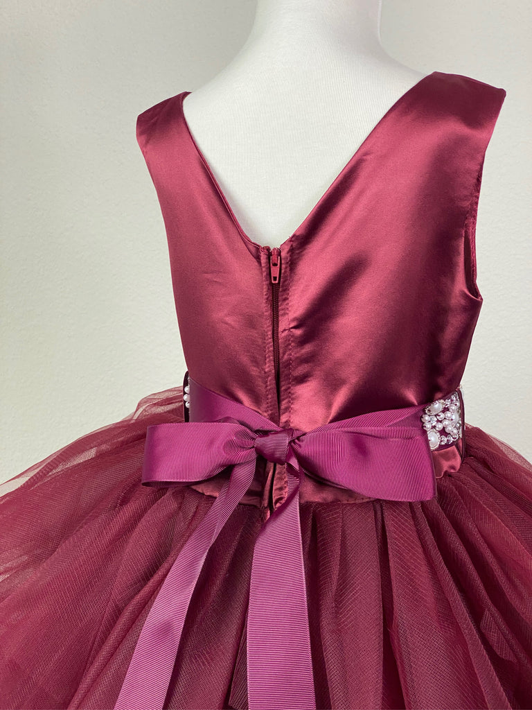 BURGUNDY  Burgundy satin bodice Pearl embellished belt going from front to back Layered burgundy tulle skirting over burgundy satin Zipper closure Dress pictured with a petticoat Petticoat not included  Choose from a tulle, cloth, or wire for best look