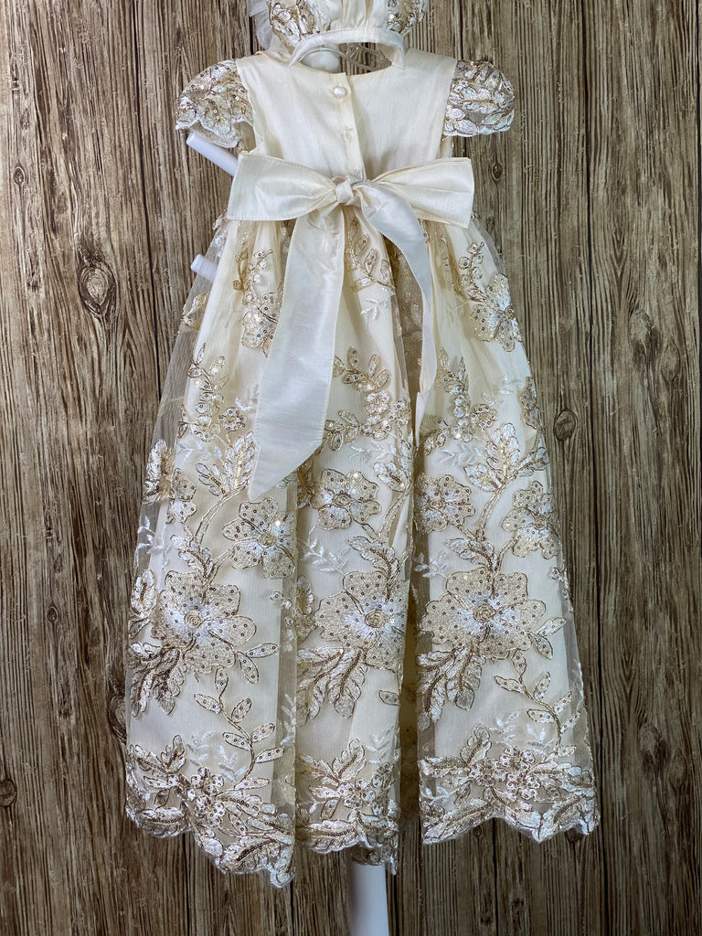 This a beautiful, one-of-a-kind baptism gown.  A lovely gown for a precious child.  Satin bodice with beautiful lace overlay Lovely lace cap sleeves Large satin skirting with lace overlay Satin bow in back Gorgeous lace bonnet Ruffled tulle brim  Satin ribbon closure Available in two colors ivory (first set of photos) & champagne (second set of photos)