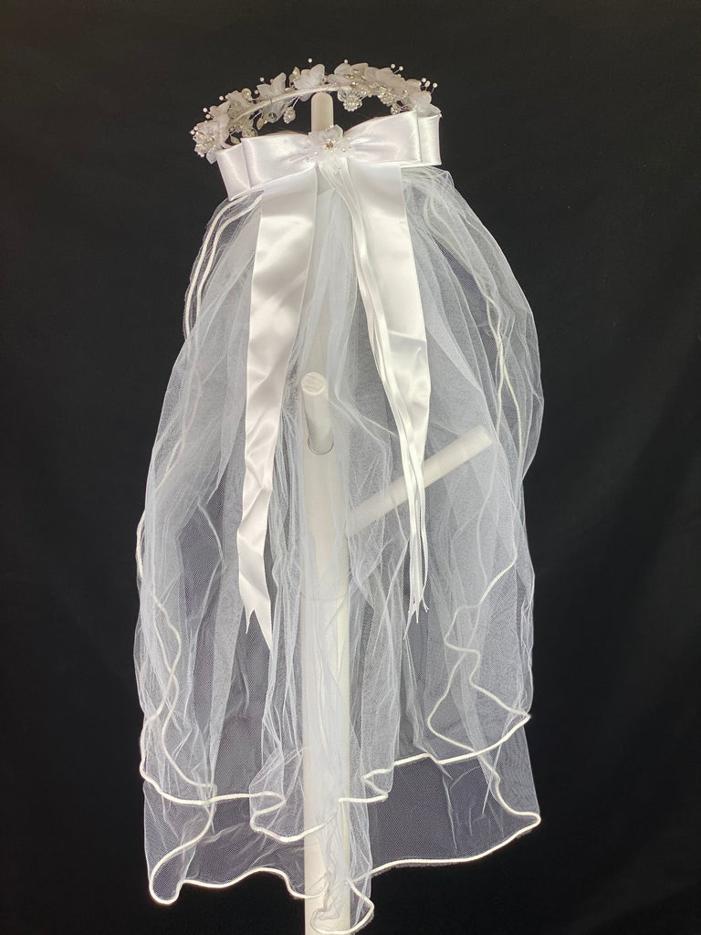 Elegant soft 2 layer tulle veil with delicate hand stitched braided satin trim around the edge and handmade flower halo crown with veil with large white satin bow on back. Organza flowers with sparkling rhinestone and pearl centers. Beautiful pearl leaves sticking out around flowers.  This double layered veil reaches approximately 24" long, with a crown diameter of 6". Veil has 2" long, 3" wide, comb to secure it in place. 