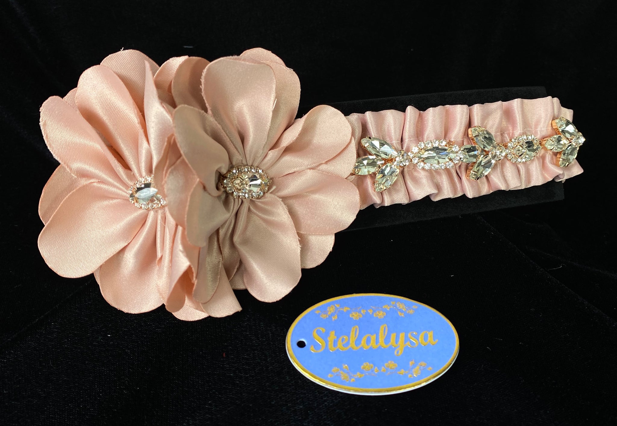 Headwrap - Pink Double Flower with Rhinestones  This is an elegant handmade and one-of-a-kind Pink headwrap with large satin flowers with large rhinestones.  The elastic headwrap is made of a soft satin with an intricate rhinestone design.  This headwrap can be worn with dresses from Stelalysa's Celebration/Pageant Collection and for any occasion!  It fits best on ages 1-6.