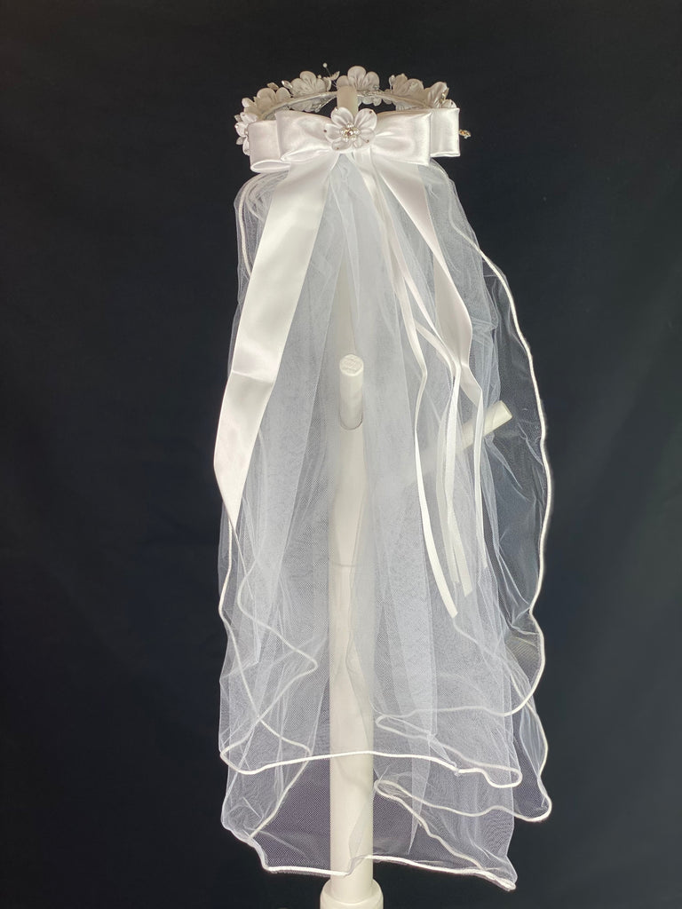 Elegant soft 2 layer tulle veil with delicate hand stitched braided satin trim around the edge and handmade flower halo crown with veil with large white satin bow on back. Stain flowers with sparkling rhinestone petals and pearled centers. Beautiful rhinestone leaves sticking out around flowers.  This double layered veil reaches approximately 24" long, with a crown diameter of 6". Veil has 2" long, 3" wide, comb to secure it in place. 