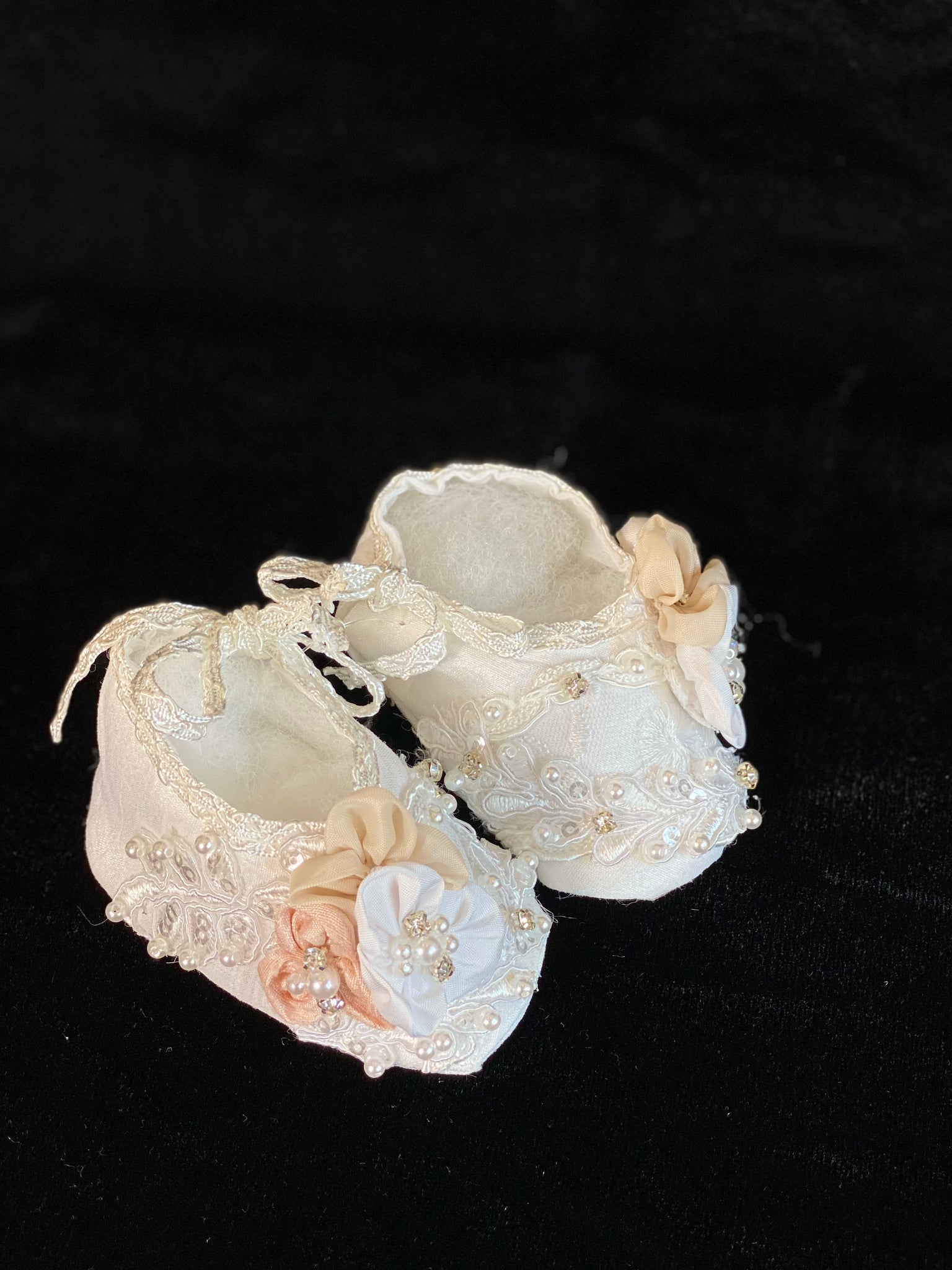 Elegant handmade ivory/white baby girl ankle boots with embroidery, lace, flowers, and jewels (pearls and crystals) with side string closure.