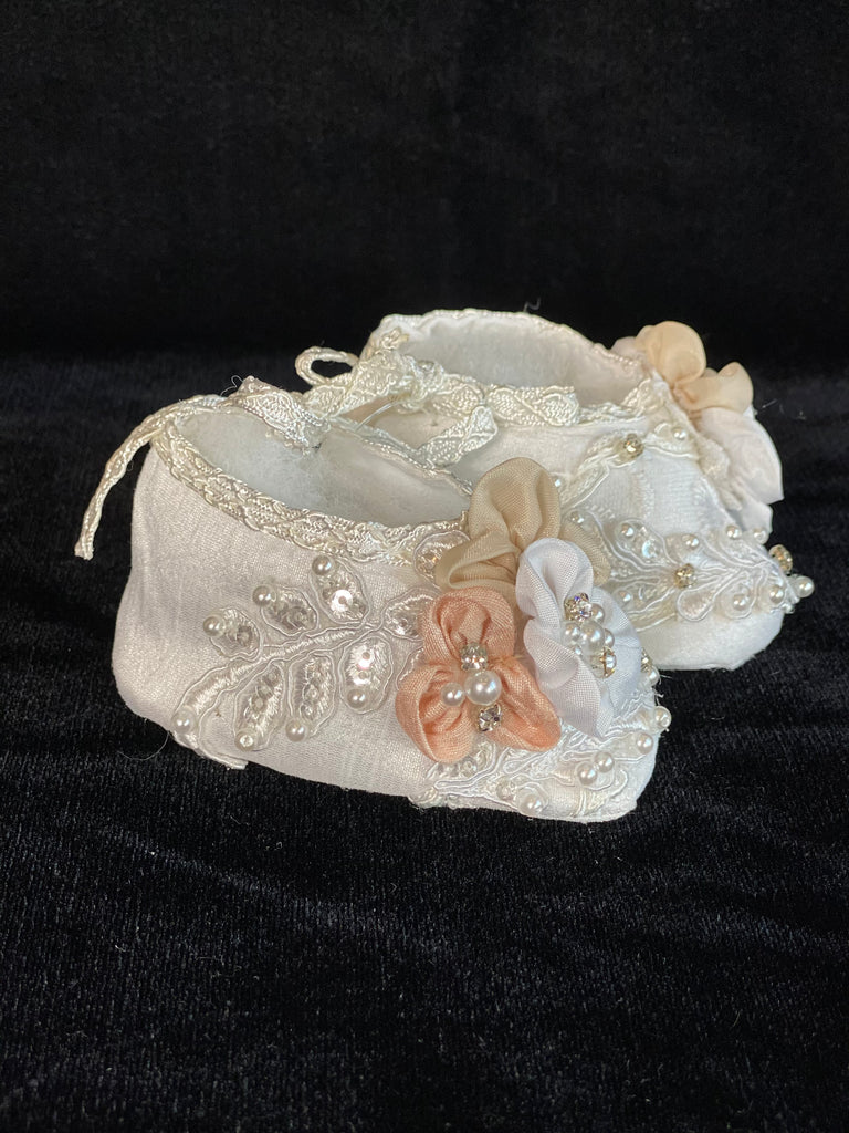 Elegant handmade ivory/white baby girl ankle boots with embroidery, lace, flowers, and jewels (pearls and crystals) with side string closure.