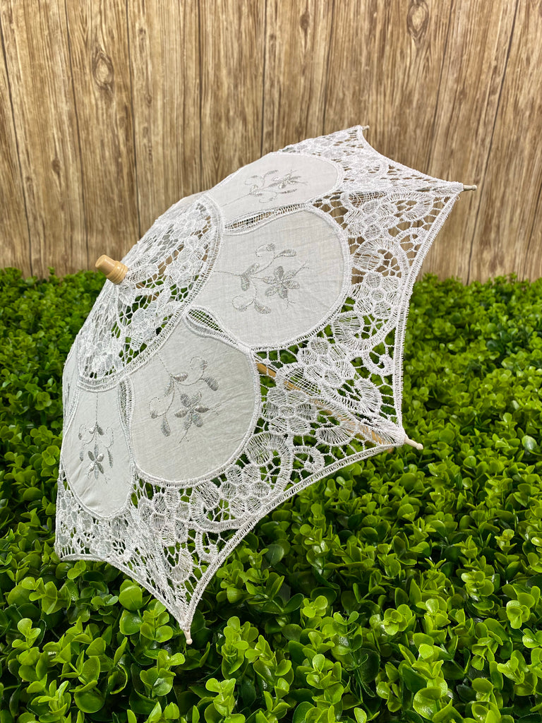 White crochet umbrella Wooden handle Easy open and closure 80 in. around, 30 in. diameter, 20 in. tall Small, perfect for girls ages 1-6
