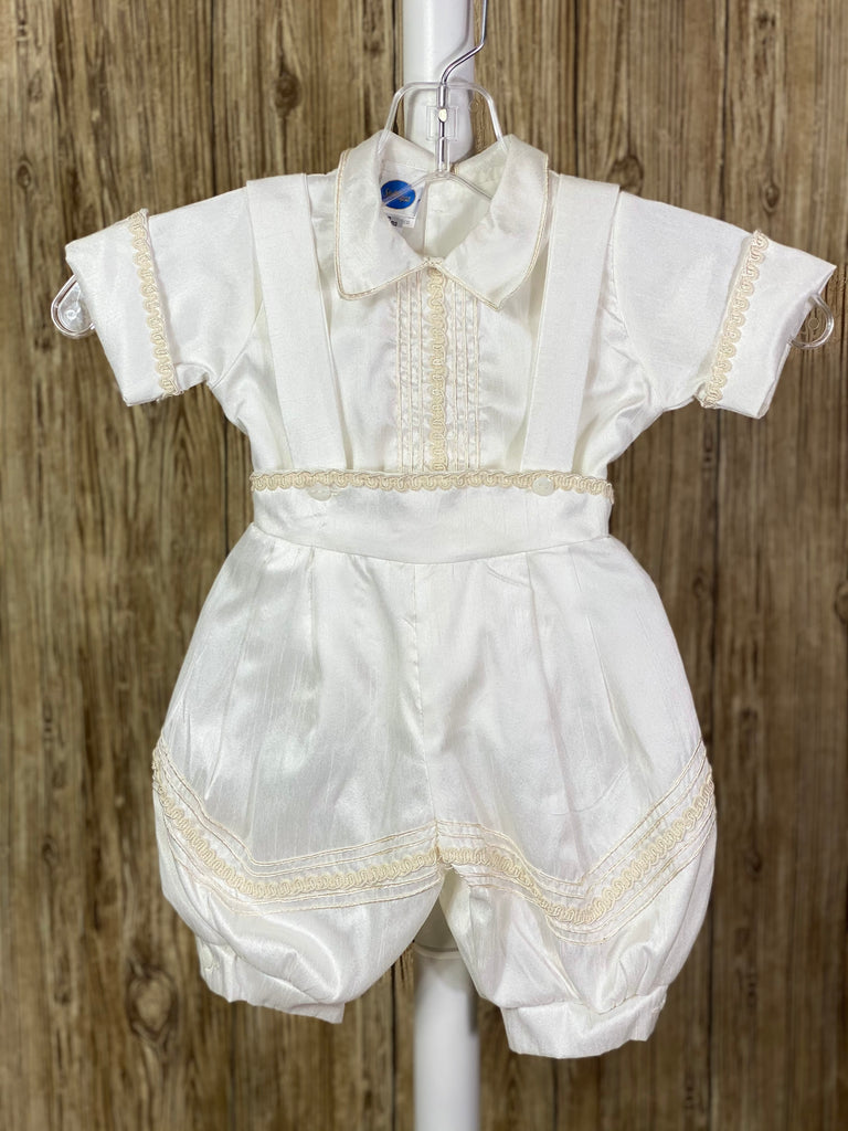 Ivory, size 6M  4-piece set including beret, one piece stole, shirt, suspender pants Embroidered cross with doves on stole Pearls, beads, and champagne jewels throughout embroidery on stole Rope closure on stole under arms and across chest Collared shirt with short sleeves Vertical rope detailing on center of shirt Buttoning on pant cuffs Elastic banding behind pants Champagne rope detailing horizontal on pant legs and beret Button closure on back of shirt Embroidered trim along edge of stole and arm cuffs