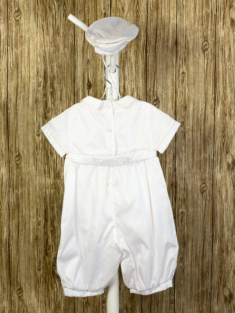 This a beautiful, one-of-a-kind boy’s baptism gown/set.  Lovely clothes for a precious child.  White, size 12M 2-piece set including romper and belt Buttoning on cuffs Collared with short sleeves Buttoning on back of romper Pleated columns on bodice and legs of romper Crochet cross lace columns on bodice and legs of romper Hand-stitched trim around legs of romper Hand-stitched leaf designs on legs of romper with pearl detailing inside Thin pin-striping on belt