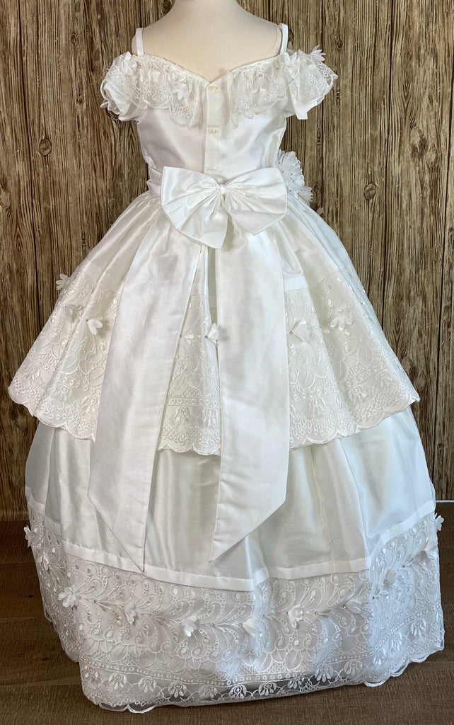 Ivory, size 10 Off the shoulder Laced trimmed along top of satin bodice Flower detailing around right side of bodice leading to skirt Gorgeous lace paneling along skirt Dress comes with detachable skirt to make dress short or long Button closure Big satin bow on back
