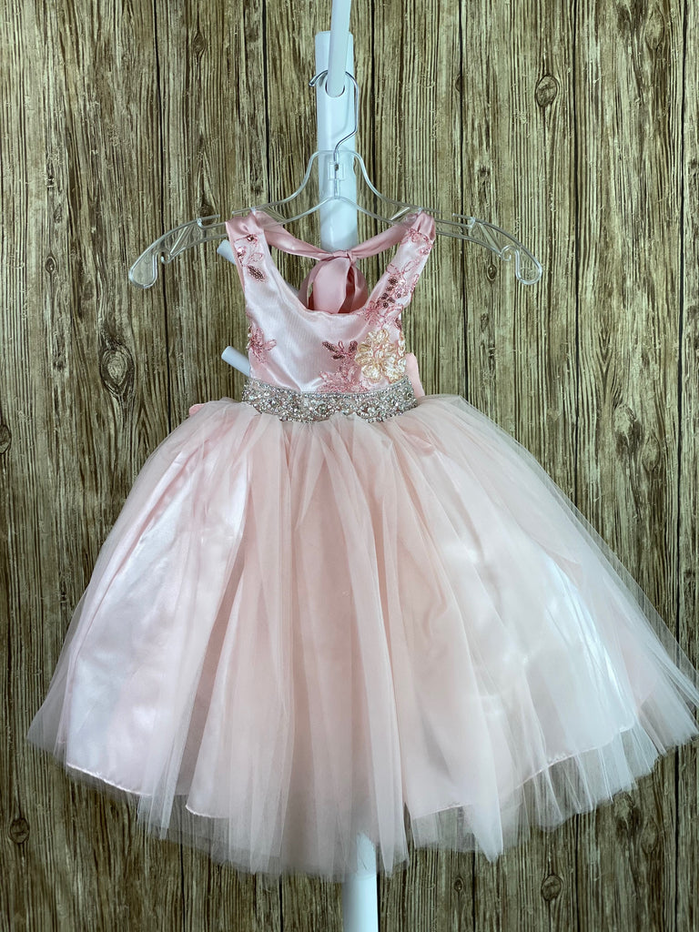 Light Pink, size 1 embroidered V-neck bodice Rhinestone band along lower bodice Light pink tulle skirting with satin underlay Ribbon closure Large light pink bow on back