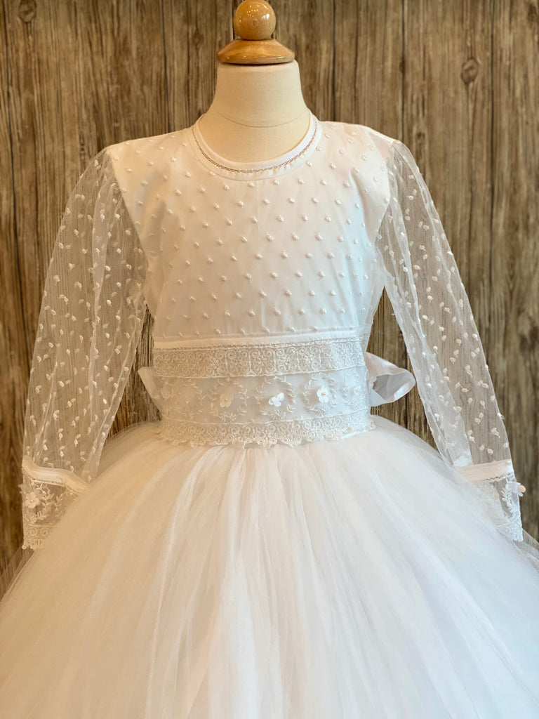 Size 10 and 12 Dotted lace bodice Full sleeve with matching dotted lace with wide flower band on wrist Wide floral and lace paneling on lower/waist  bodice Tulle skirt Back button closure  Satin ribbon for bow
