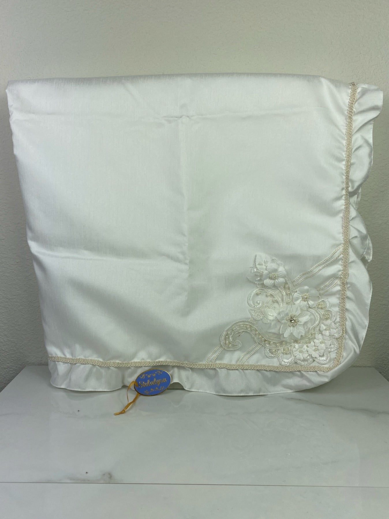 Beautiful ivory silk baptism blanket with flower, lace, pearls, and crystals.