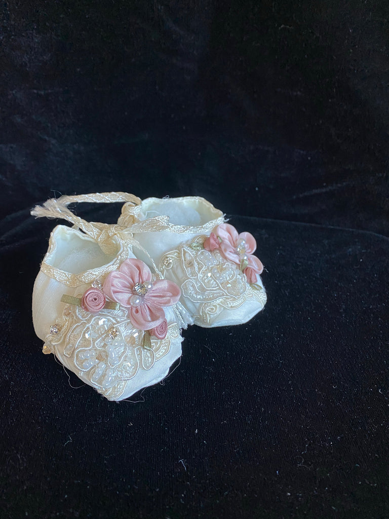Elegant handmade ivory baby girl ankle boots with embroidery, lace, flowers, and jewels (pearls and crystals) with side string closure.
