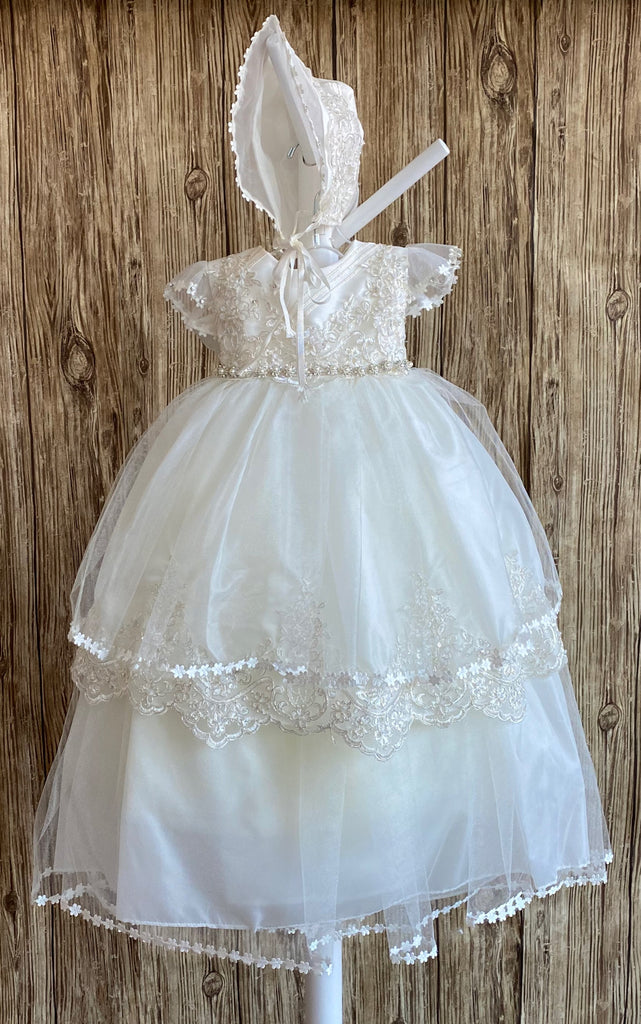 This a beautiful, one-of-a-kind baptism gown.  A lovely gown for a precious child.  Dress Ivory, size 6M  Satin bodice with embroidered floral overlay Tulle half sleeve with flower edge Rhinestone flowers with pearl center belting Tulle skirting with embroidered scalloped edge Slip  Satin bodice Simple tulle skirting with flower edge Bonnet  Satin embroidered bonnet  Flowers along mesh brim