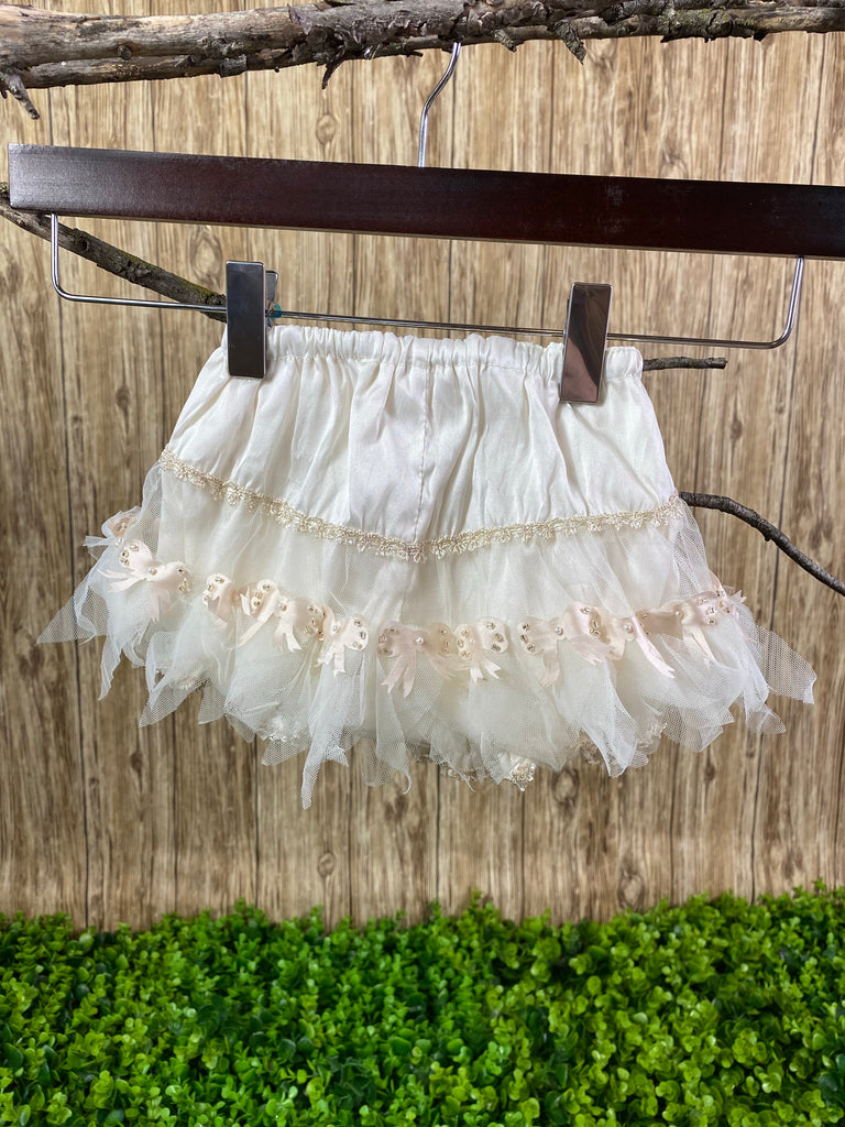 Baptism Bloomers - Ivory bloomers with Light Pink Bows  These ivory bloomers are exclusive to Stelalysa!  They are handmade and one of a kind.  The ruffle design in the backside is made of tulle and lace. Cute light pink satin bows with beads and pearls decorate each bow.  One size fits 3 to 12 month old babies.   