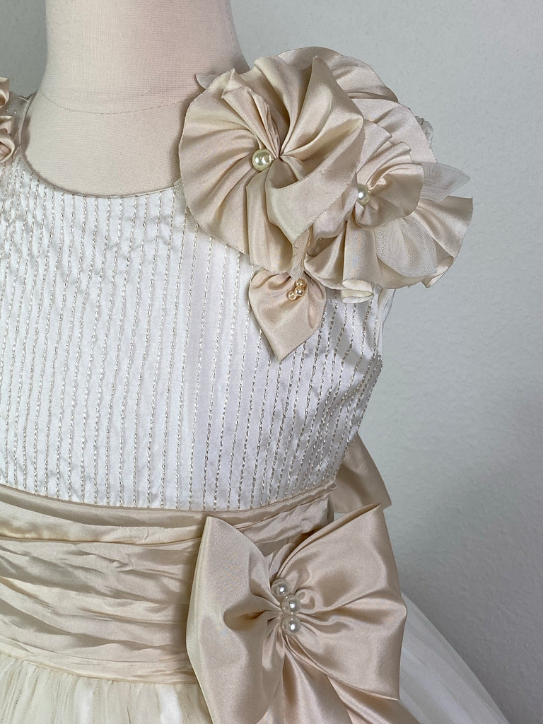 Ivory, size 8 Embroidered ivory pinstripe bodice with large pearled beige flowers on shoulder Beige cummerbund with pearl detailing on large bow Layered ivory tulle skirt with flower detailing on trim of first layer Six stacked braided stripes along edge of second tulle layer Satin covered button closure Beige Satin Ribbon for large bow