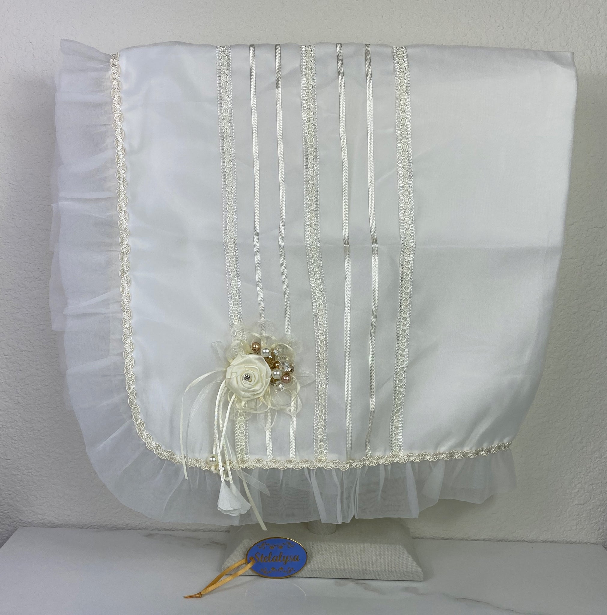 silk ivory blanket with flower, jewels, ruffled edge, and lace