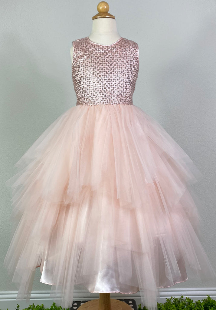 Blush, size 8 Blush satin bodice Satin trimmed neckline and sleeve Glittered tulle over satin bodice Ruffled layered tulle skirting over satin Zipper closure Blush ribbon for bow in back Dress pictured with a petticoat Petticoat not included  Choose from a tulle, cloth, or wire for best look