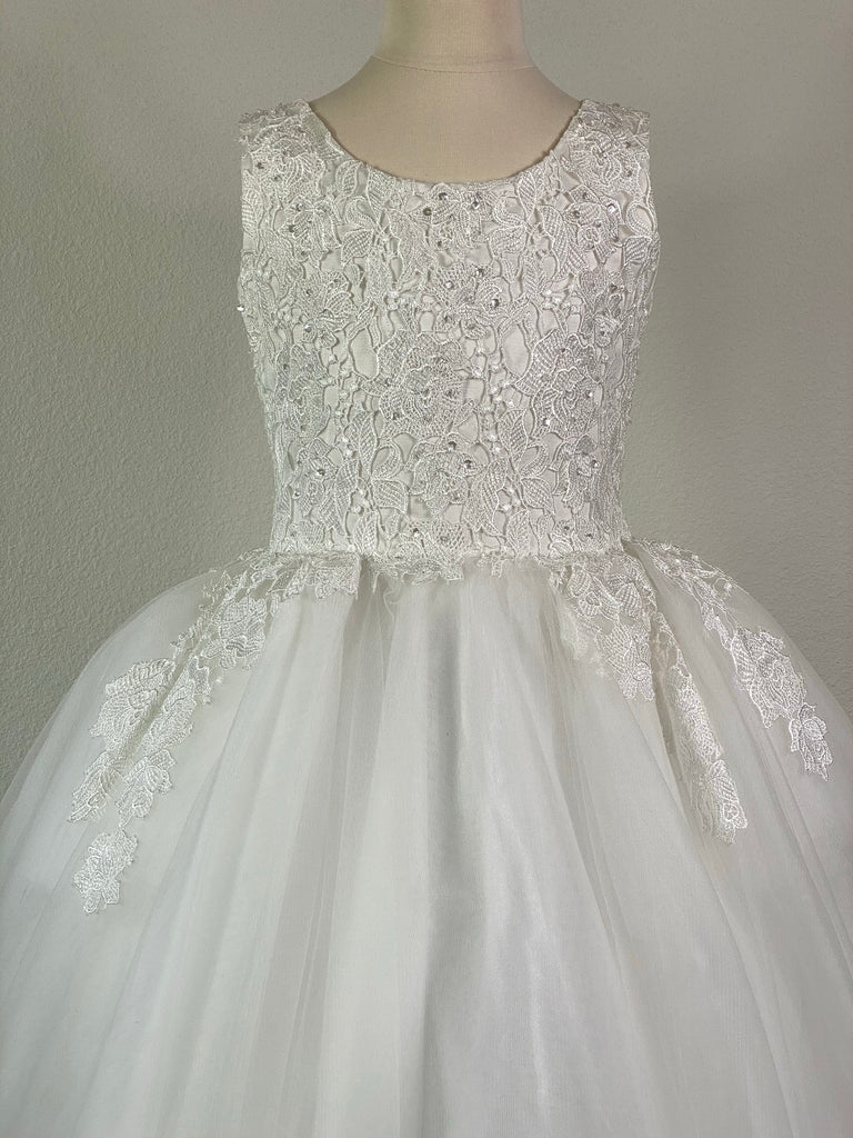 White, size 10 Embroidered floral bodice flowing into tulle on skirt with crystals Satin skirt with tulle overlay Hidden zipper closure The layered tulle skirt creates heaviness to dress
