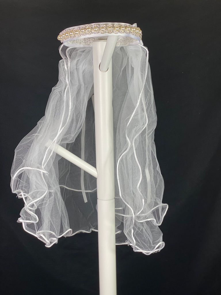 Elegant soft 2 layer tulle veil with delicate hand stitched braided satin trim around the edge and handmade flower halo crown with veil with large white satin bow on back. Beautiful sparkling rhinestone band around crown. Ivory pearl center on sparkling rhinestone bow.  This double layered veil reaches approximately 24" long, with a crown diameter of 6". Veil has 2" long, 3" wide, comb to secure it in place. 