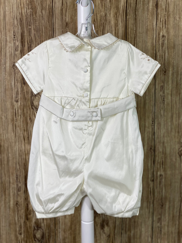 This a beautiful, one-of-a-kind boy’s baptism gown/set.  Lovely clothes for a precious child.  Ivory, size 6M  3-piece set including mozzetta, romper, and thin belt Collared romper with short sleeves Buttoning on pant cuffs Button closure on back of jumper and belt Hand stitched trim along sleeve cuffs Pin tucks diagonal on top half of jumper Embroidered leaf design on romper, belt, and mozzetta Embroidered trim along romper trim Rope closure on mozzetta