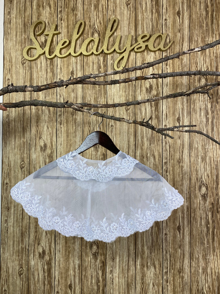 Beautiful tulle shawl with embroidered lace, along a scalloped edge.  This shawl can be worn with either a white or ivory communion dress/gown from our collection.  She will look like a princess wearing this elegant shawl on her special day!