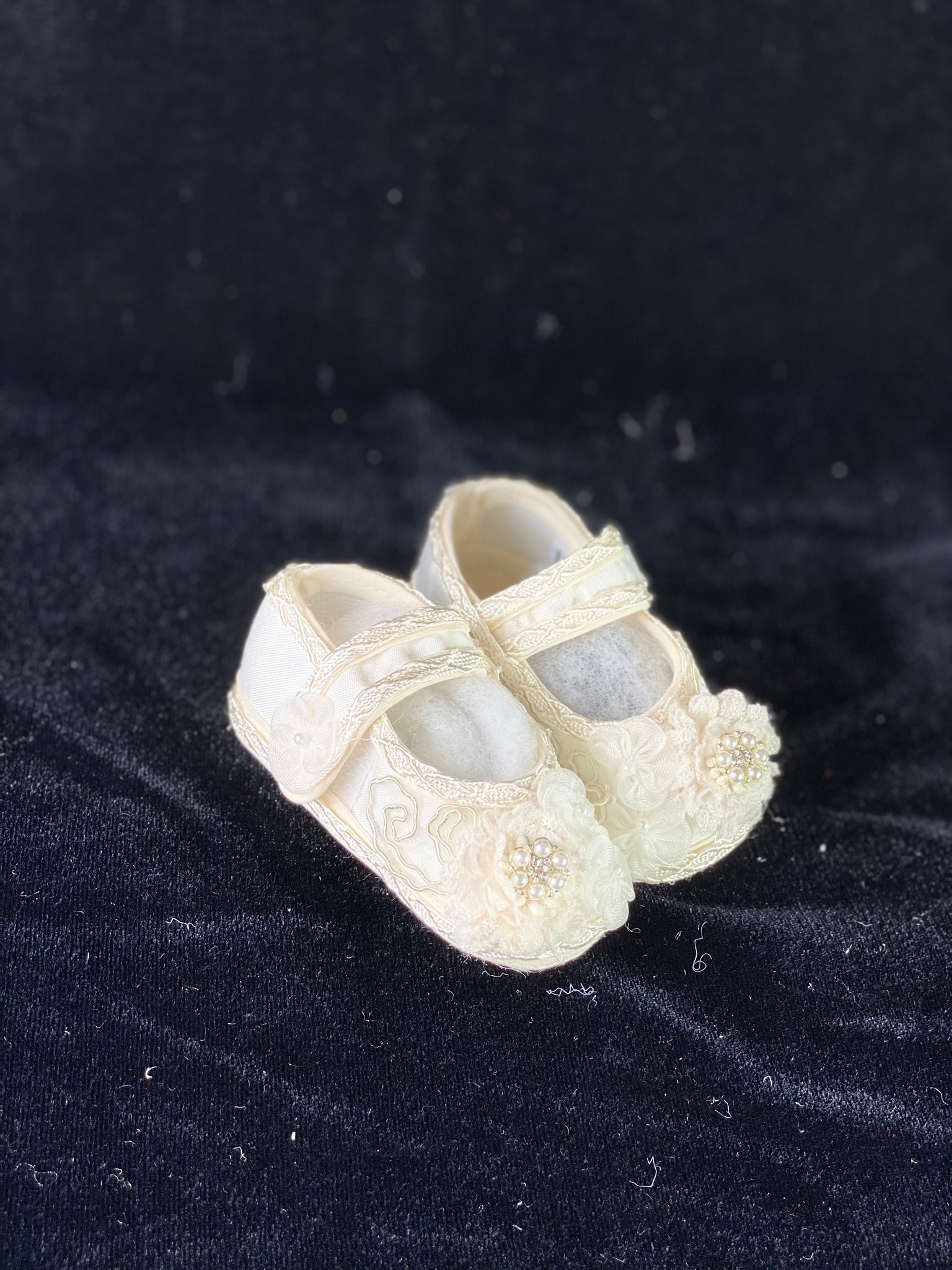 Elegant handmade white and ivory baby girl shoes with embroidery, lace, flowers, and jewels (pears and crystals).