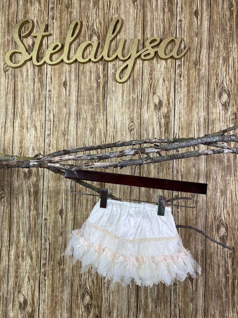 Baptism Bloomers - Ivory bloomers with Light Pink Bows  These ivory bloomers are exclusive to Stelalysa!  They are handmade and one of a kind.  The ruffle design in the backside is made of tulle and lace. Cute light pink satin bows with beads and pearls decorate each bow.  One size fits 3 to 12 month old babies.   