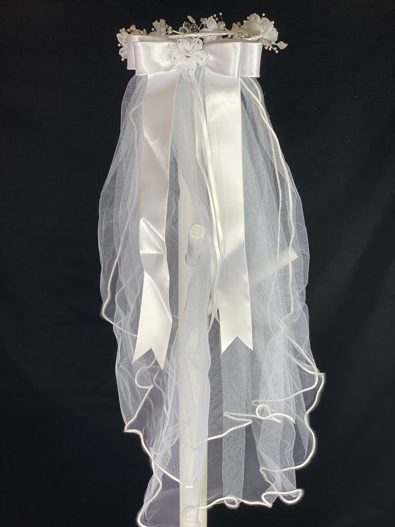 Elegant soft 2 layer tulle veil with delicate hand stitched braided satin trim around the edge and  handmade flower halo crown with veil with large white satin bow on back. Stain flowers with sparkling rhinestone petals and centers.  Crystal flowers between organza flowers. Beautiful crystal leaves sticking out around flowers.  This double layered veil reaches approximately 24" long, with a crown diameter of 6". Veil has 2" long, 3" wide, comb to secure it in place. 