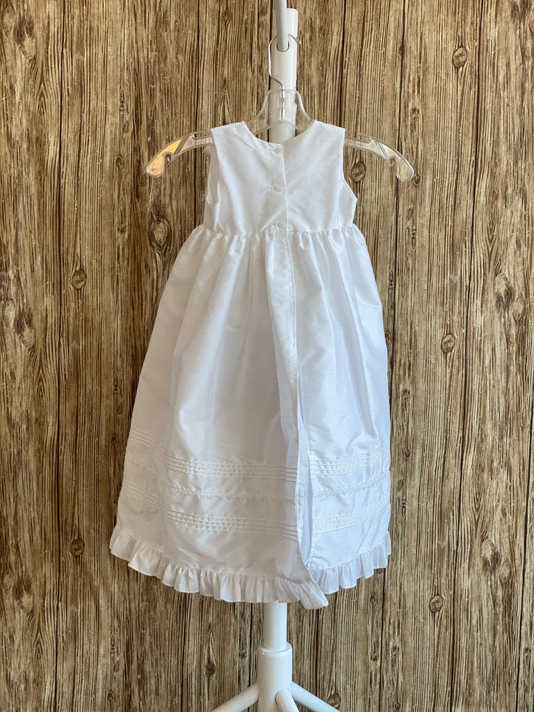 This a beautiful, one-of-a-kind baptism gown.  A lovely gown for a precious child.  White, size 6M Silk bodice with pleated square effect Pearls throughout bodice Two piece silk skirting Pleated square detailing on skirt with pearls throughout Ribboned pinstripes on skirting Ruffled trip along skirt edge Ruffled sleeves Button closure Matching bonnet