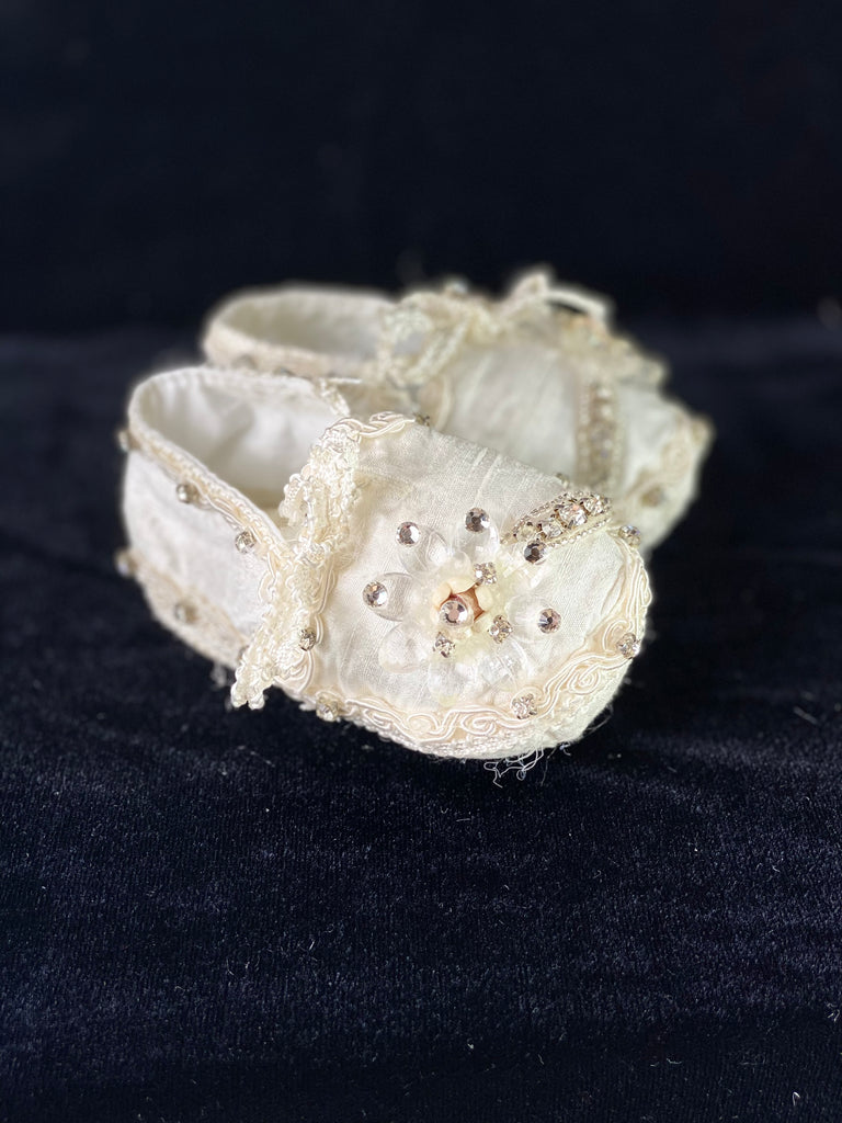 Elegant handmade ivory baby girl shoes with embroidery, lace, flowers, and jewels (crystals).