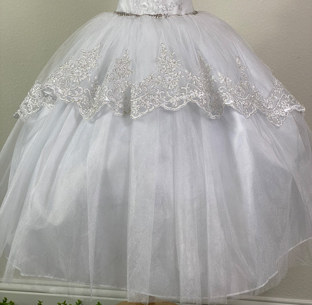 White, size 4 White sweetheart neckline bodice White floral lace overlay on bodice Swirled rhinestone bands on straps Thin rhinestone band along bodice Layered tulle over satin skirting Embroidered white and silver trim along top layer of tulle that Vs into the back Ribbon closure with elastic banding Dress pictured with a petticoat Petticoat not included  Choose from a tulle, cloth, or wire for best look