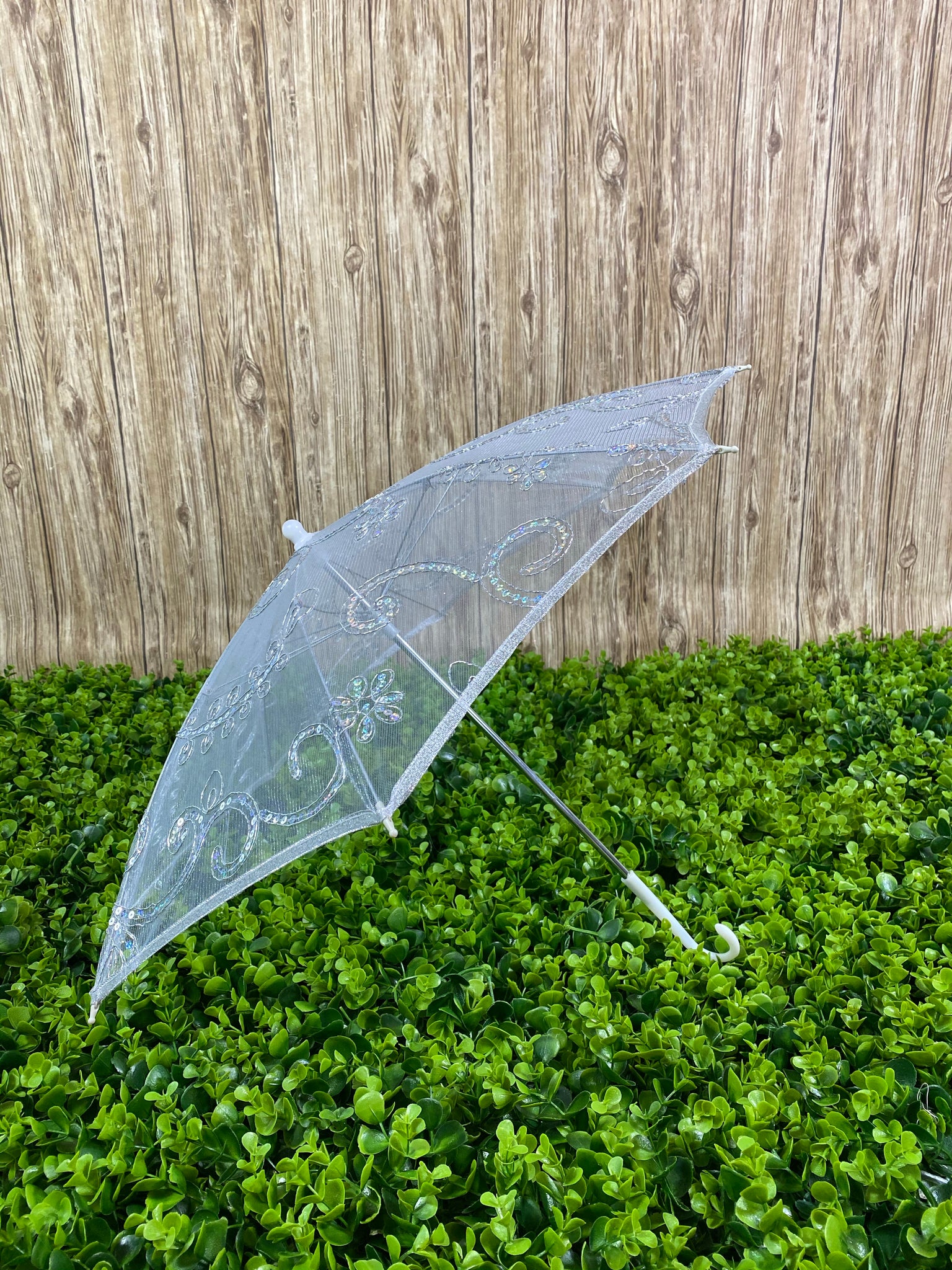 Silver see through mesh umbrella with sequins detailing. 80in around, 30in in diameter, 20in tall Perfect for girls ages 1-6