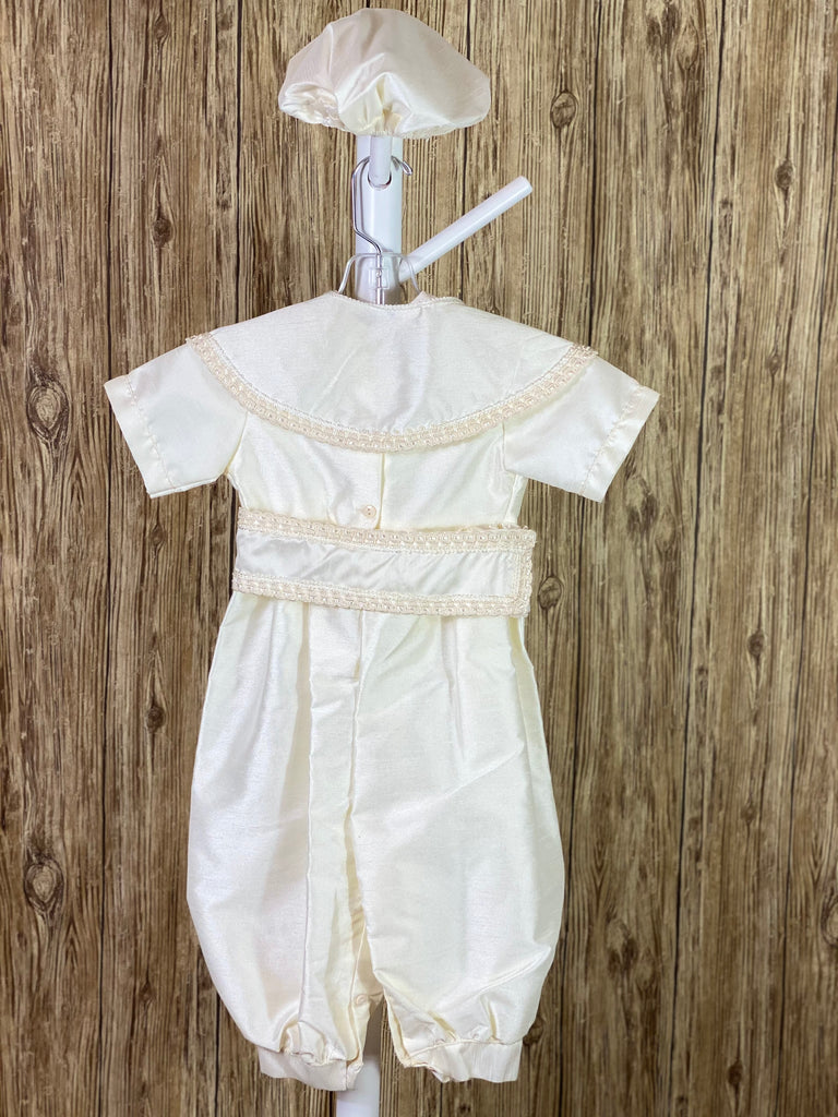 IVORY  4-piece ivory set including romper, belt, beret and mozzetta Collared with short sleeve Intricate braided trim lining belt and mozzetta edges Thin trim lining cuffs, beret, and bodice Button closure on back Rope closure on mozzetta