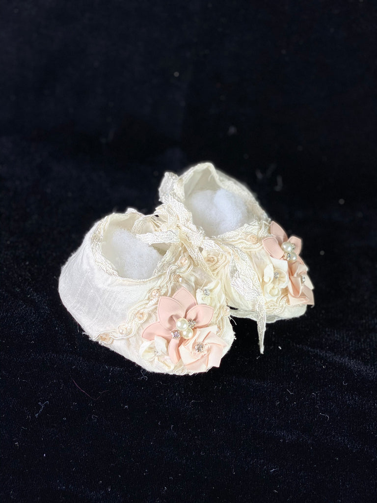 Elegant handmade ivory baby girl shoes with embroidery, lace, flowers, and jewels (pearls and crystals).