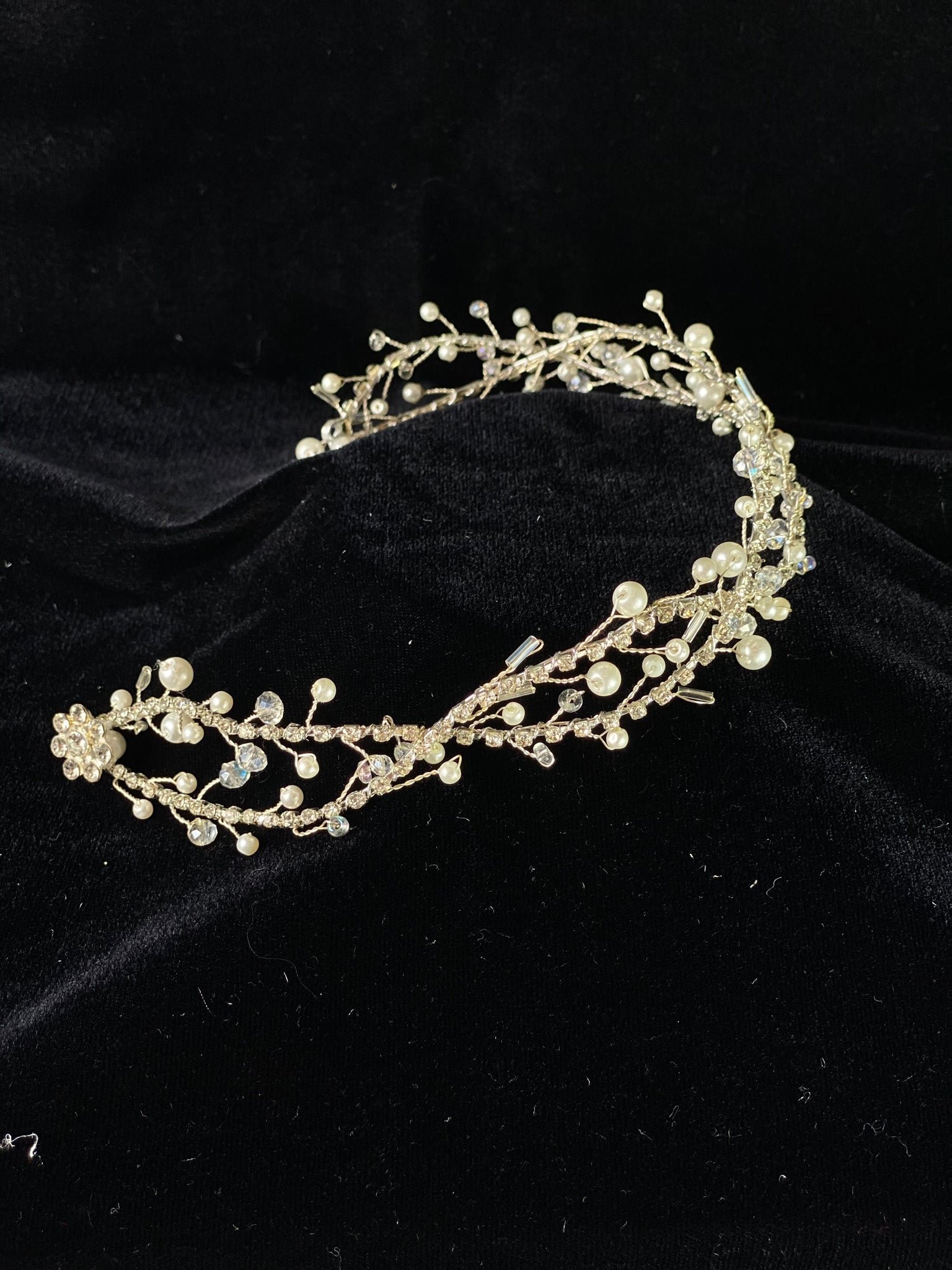 Beautiful headband applique with pearl and rhinestone detailing.   Headband is 14.5" long, to wrap beautifully around the head. To secure in on the head properly, bobby pins will need to be used, 