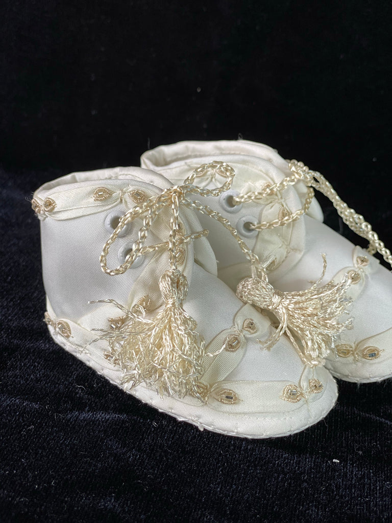 Elegant handmade English style ankle boots in ivory with ribbons, embroidery, jewels, and tassel like laces.