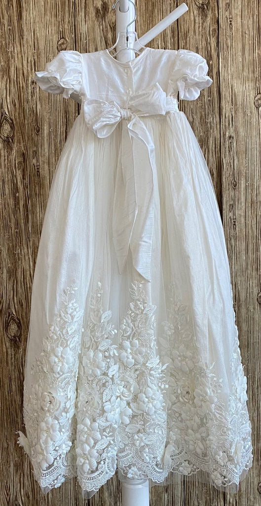 This a beautiful, one-of-a-kind baptism gown.  A lovely gown for a precious child.  Ivory, size 6M  Satin bodice  Satin puffed sleeve Large pearl and rhinestone belt Tulle skirting with embroidered flowers along bottom Rhinestone centers on flowers