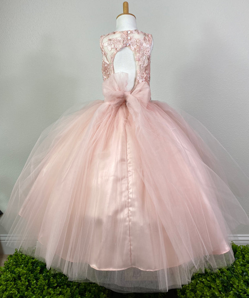 Blush, size 6 Blush satin illusion bodice Embroidered floral lace over bodice Pearl and rhinestone band along lower bodice Peach satin skirting with tulle overlay Keyhole back with pearl button closure Large tulle bow in back Dress pictured with a petticoat Petticoat not included  Choose from a tulle, cloth, or wire for best look