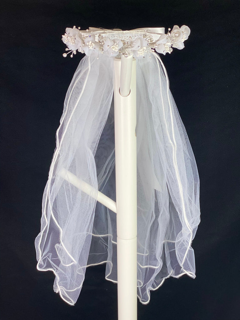 Elegant soft 2 layer tulle veil with delicate hand stitched braided satin trim around the edge and handmade flower halo crown with veil with large white satin bow on back. Organza flowers with sparkling rhinestone petals. Center of flowers are full of beautiful white stamen.  Beautiful rhinestone leaves sticking out around flowers.  This double layered veil reaches approximately 24" long, with a crown diameter of 6". Veil has 2" long, 3" wide, comb to secure it in place. 