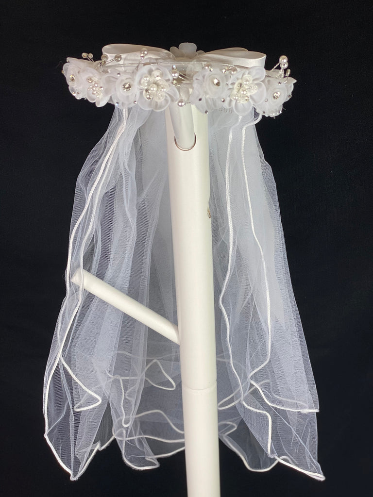 Elegant soft 2 layer tulle veil with delicate hand stitched braided satin trim around the edge and handmade flower halo crown with veil with large white satin bow on back. Organza flowers with sparkling rhinestone petals and centers. Beautiful pearl leaves sticking out around flowers.  This double layered veil reaches approximately 24" long, with a crown diameter of 6". Veil has 2" long, 3" wide, comb to secure it in place. 